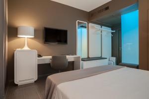Postel nebo postele na pokoji v ubytování 8Piuhotel