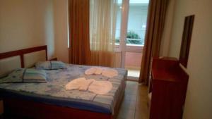 A bed or beds in a room at Apartment in Complex TARA
