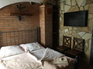 Ένα ή περισσότερα κρεβάτια σε δωμάτιο στο Apartmány Patriot