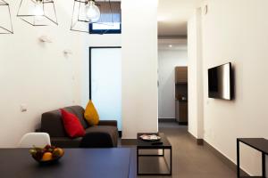 a living room with a couch and a table at Acate81 Lifestyle Apartment in Naples
