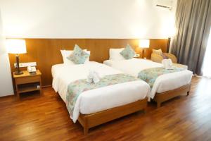 NDC Resort & Spa客房内的一张或多张床位