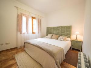 Ein Bett oder Betten in einem Zimmer der Unterkunft Bunyola
