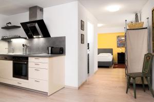 Kuchnia lub aneks kuchenny w obiekcie Apartments Golden Roof by Penz