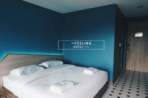 Postel nebo postele na pokoji v ubytování The Feeling Hotel