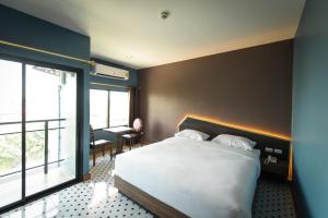 Una cama o camas en una habitación de The Feeling Hotel