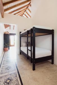 a bedroom with two bunk beds in a room at Villas Los Olivos in Ayampe