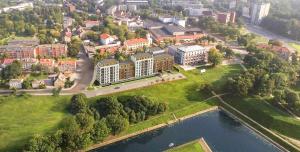 an aerial view of a city with a river and buildings at Bangų g. Apartamentai in Klaipėda