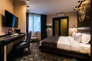 Postel nebo postele na pokoji v ubytování Hotel Adamo