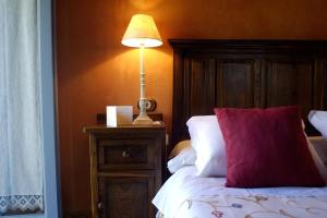 A bed or beds in a room at Casa do Castelo de Andrade