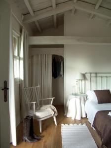 A bed or beds in a room at Casa do Castelo de Andrade