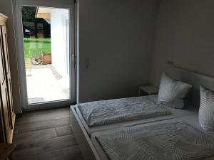 Llit o llits en una habitació de Ferienwohnung Scholter