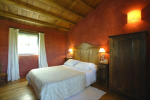 A bed or beds in a room at Casa do Castelo de Andrade
