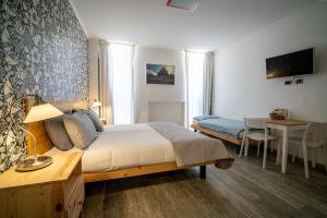 Ένα ή περισσότερα κρεβάτια σε δωμάτιο στο Alpen Pila Residence