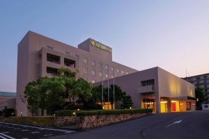 a building with a sign on the top of it at Takamatsu Kokusai Hotel in Takamatsu