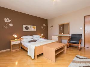 Postel nebo postele na pokoji v ubytování Apartments Nada