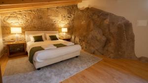 Postel nebo postele na pokoji v ubytování Casas da Penha + 24 fotografií