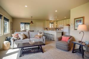 a living room with a couch and a table at Apache Greens in Sisters