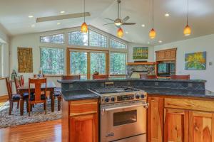 a kitchen with a stove and a dining room at Montgomery Estates Retreat in South Lake Tahoe