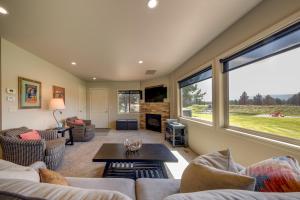 a living room with a couch and a table at Apache Greens in Sisters