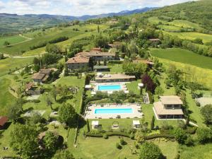 an aerial view of a estate with a swimming pool at Borgo Corsignano in Poppi