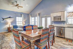 a kitchen with a table and chairs in a room at Breezy by the Beach in Corpus Christi