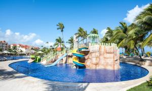 a water slide at a resort with a water park at Occidental Caribe - All Inclusive in Punta Cana