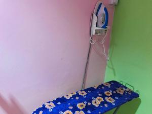 a room with a table with flowers on it at Home Inn Hotel in Ipoh