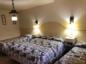 Кровать или кровати в номере Rosa De Los Vientos