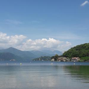 a large body of water with mountains in the background at Guest House Seme Di Faggio in Miasino
