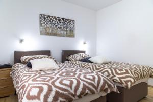 Postel nebo postele na pokoji v ubytování Apartments Raspolic