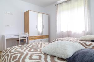 Postel nebo postele na pokoji v ubytování Apartments Raspolic