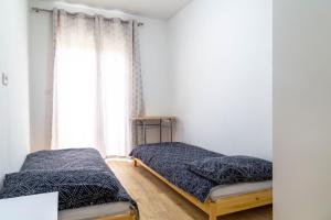 Postel nebo postele na pokoji v ubytování Apartments Raspolic