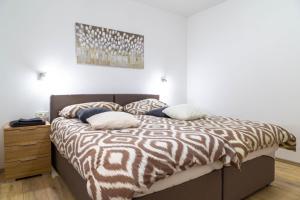 Postel nebo postele na pokoji v ubytování Apartments Raspolic