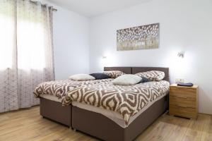 Postel nebo postele na pokoji v ubytování Apartments Raspolic