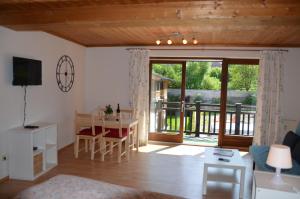 a living room with a table and a dining room at City-apart Kitzbühel Stadt in Kitzbühel