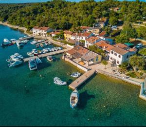 an aerial view of a harbor with boats in the water at Kuća za odmor- Simona in Punta Križa