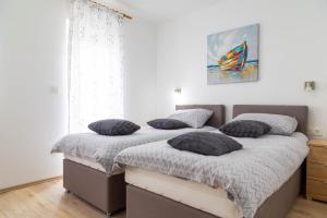 Postel nebo postele na pokoji v ubytování Apartments Raspolic