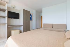 Łóżko lub łóżka w pokoju w obiekcie Hotel Palia La Roca