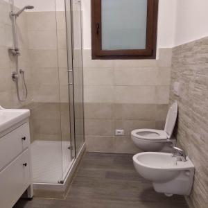 a bathroom with a shower and a toilet and a sink at Casa Lin in Celle Ligure