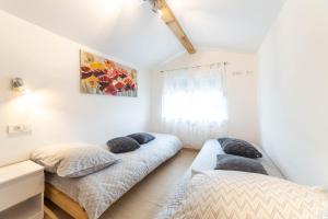 Postel nebo postele na pokoji v ubytování Apartments Raspolic