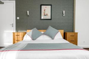 Postel nebo postele na pokoji v ubytování Flexistay Tulsi Aparthotel