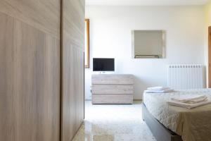 TV a/nebo společenská místnost v ubytování B&B Alba sul Mare Guest House