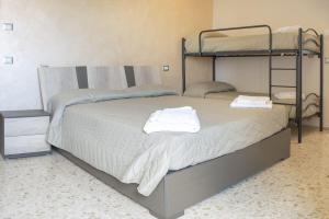 Postel nebo postele na pokoji v ubytování B&B Alba sul Mare Guest House