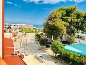 a view from a balcony of a apartment with a swimming pool at Rodi Garganico in Foce Varano