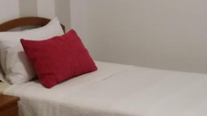 A bed or beds in a room at Apartamentos Timón Puerto