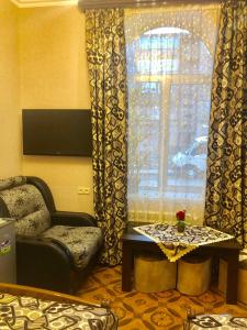 a living room with a couch and a window at Har-Mar Hotel in Goris