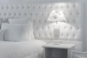 Cama ou camas em um quarto em La Mision Hotel Boutique