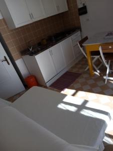 Kuchyň nebo kuchyňský kout v ubytování Appartamento in dimora tipica
