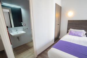 Cama o camas de una habitación en Apartaments Atzavara