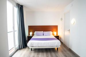 Cama o camas de una habitación en Apartaments Atzavara